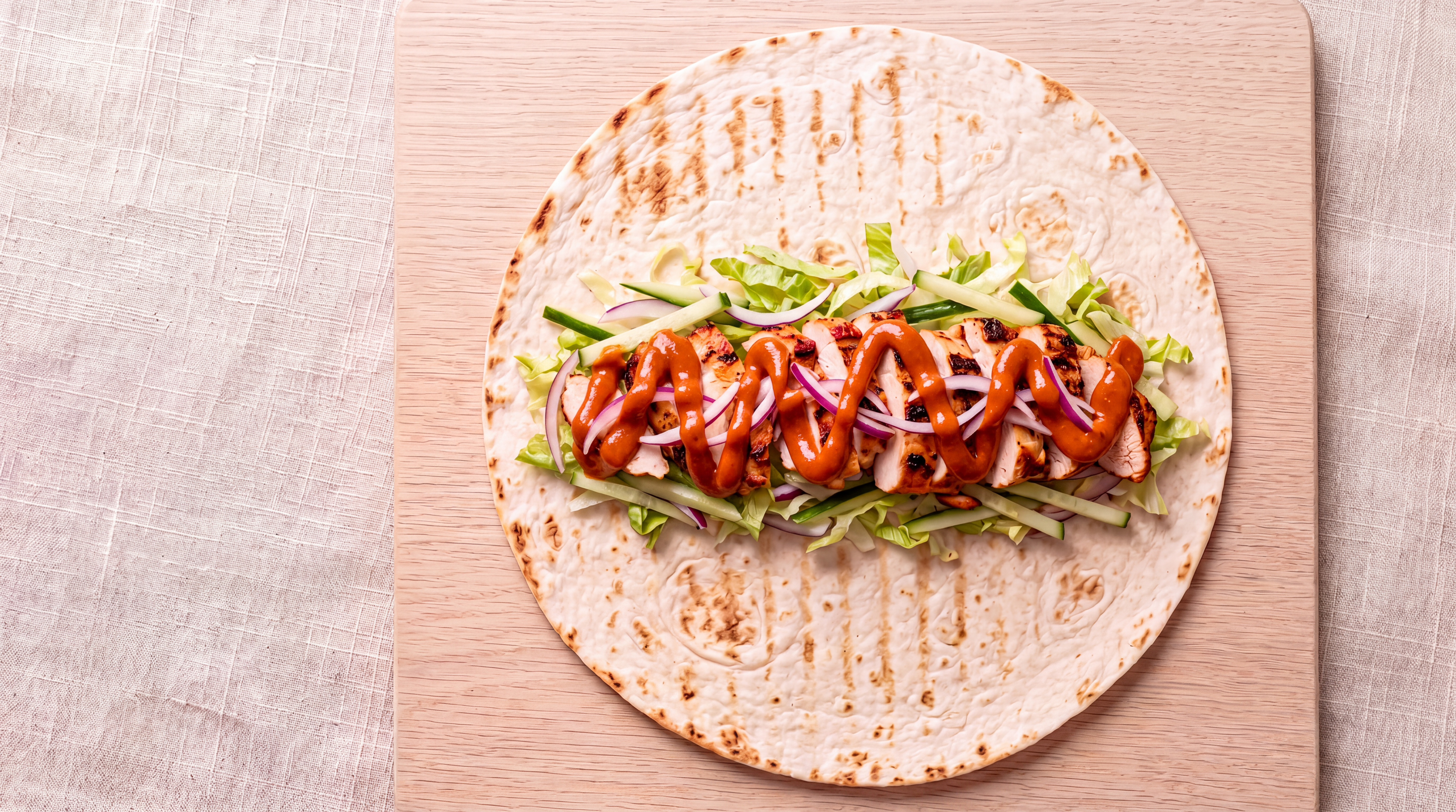 The same chicken wrap with PØURTEIN poured over it